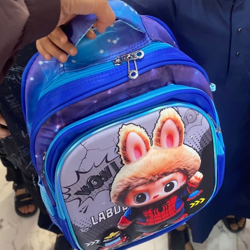 A new school bag being handed to a student